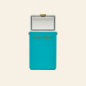 A turquoise rectangular Fieldbar Drinks Box by Fieldbar, featuring a white interior and gold accents, is shown open against a beige background—blending classic style with excellent thermal performance.