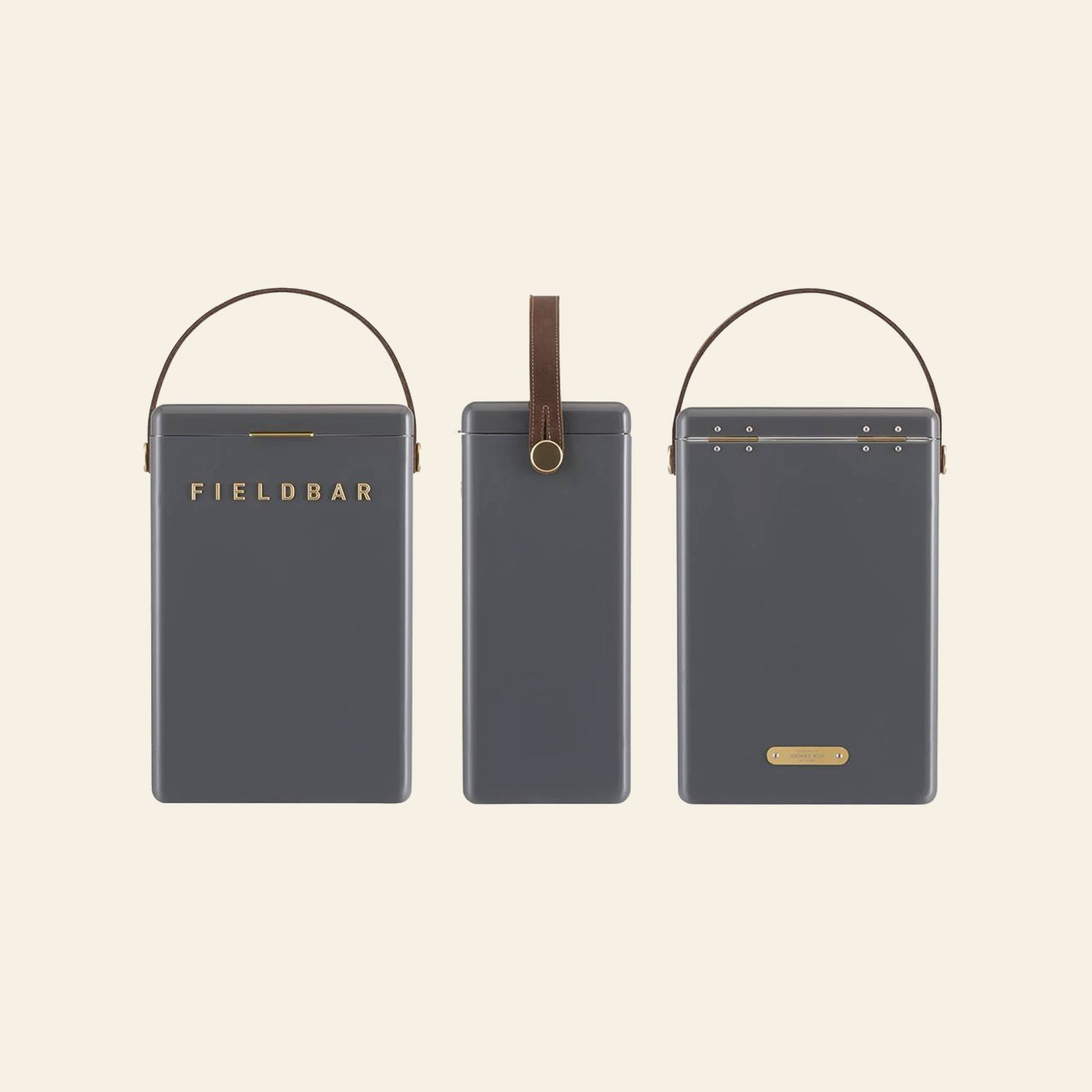 Three dark gray rectangular Fieldbar Drinks Boxes with brown handles are shown from the front, side, and back. The front displays FIELDBAR in gold, highlighting the portable cooler’s renowned thermal performance.