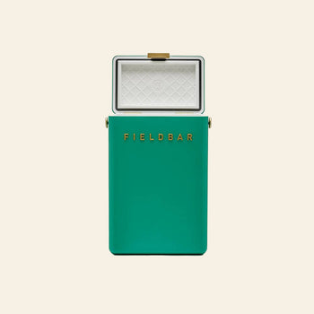 A green Fieldbar Drinks Box cooler by Fieldbar with a gold latch sits open, revealing a white diamond-patterned interior—crafted for superior thermal performance.