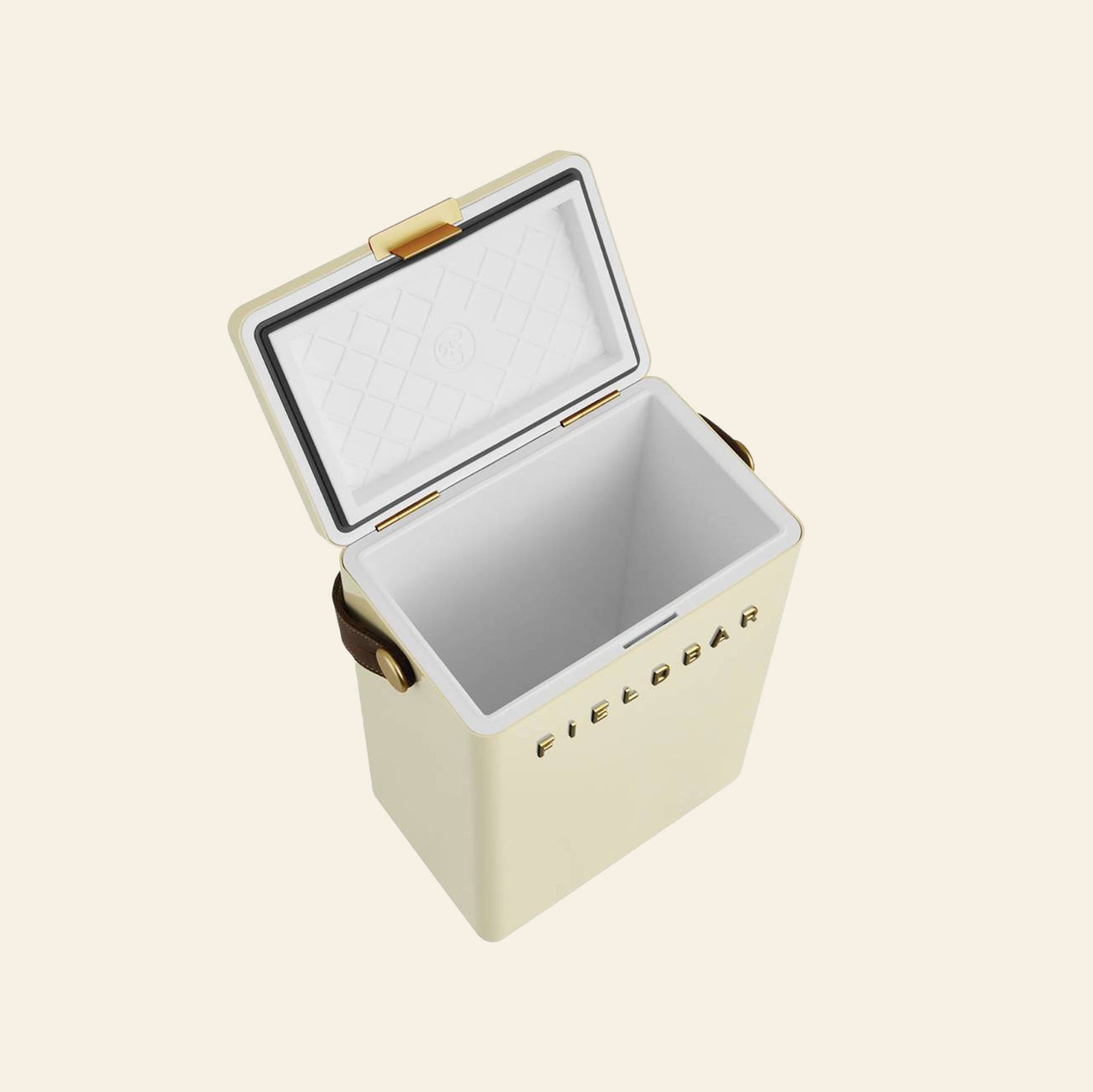 The Fieldbar Drinks Box, shown open in a cream color with gold accents and a quilted interior, stands out against a plain light background, showcasing the stylish Fieldbar design and superior thermal performance.