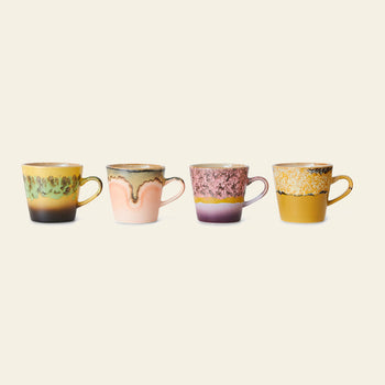 The HKLIVING 70s Ceramics: Americano Mugs, Set of 4, showcases colorful, hand-glazed stoneware mugs with unique designs and artistic textures, inspired by vintage 70s ceramics and arranged on a plain background.