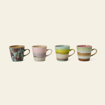 HKLIVING 70s Ceramics: Americano Mugs, Set of 4 by HKLIVING showcases four mugs with unique, colorful patterns and pastel tones, each featuring a distinct blend of earthy and pastel shades inspired by 70s ceramics.
