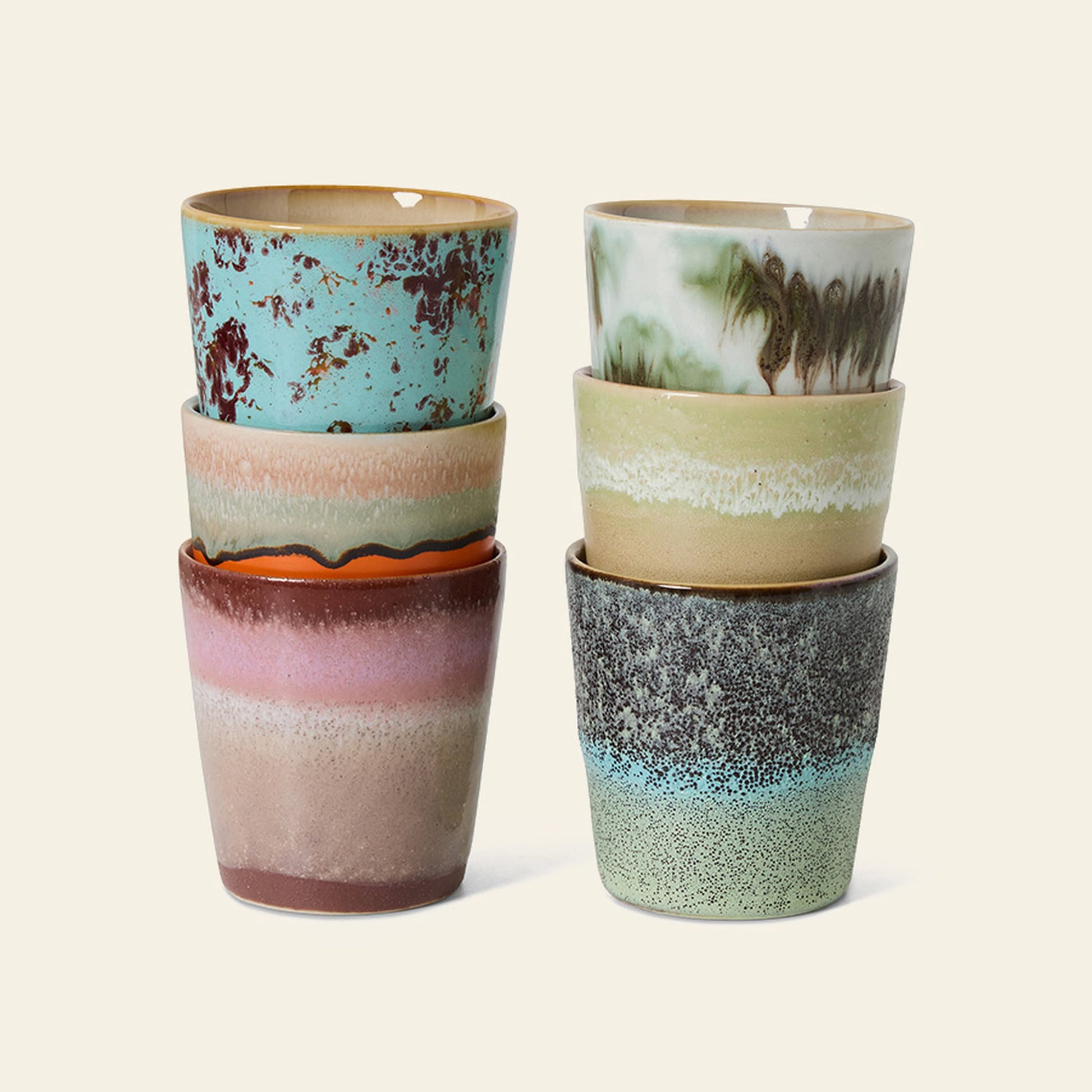 The HKLIVING 70s Ceramics Coffee Mugs Set of 6 features unique, hand-glazed mugs in blue, green, brown, pink, and cream tones from HKLIVING, stacked two columns by three against a light background.