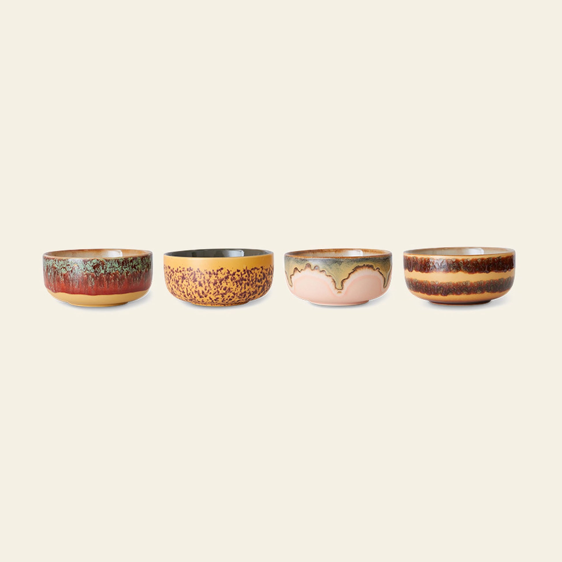 The HKLIVING 70s Ceramics Dessert Bowls, Set of 4, features uniquely patterned bowls in brown, beige, green, and orange glazes—each with retro 70s-inspired textures—arranged in a row against a plain background.