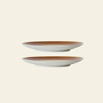 The HKLIVING 70s Ceramics: Dinner Plates, Set of 2 - Supernova are shown stacked apart on a beige background, highlighting their unique hand-glazed brown gradient rims and white bases.
