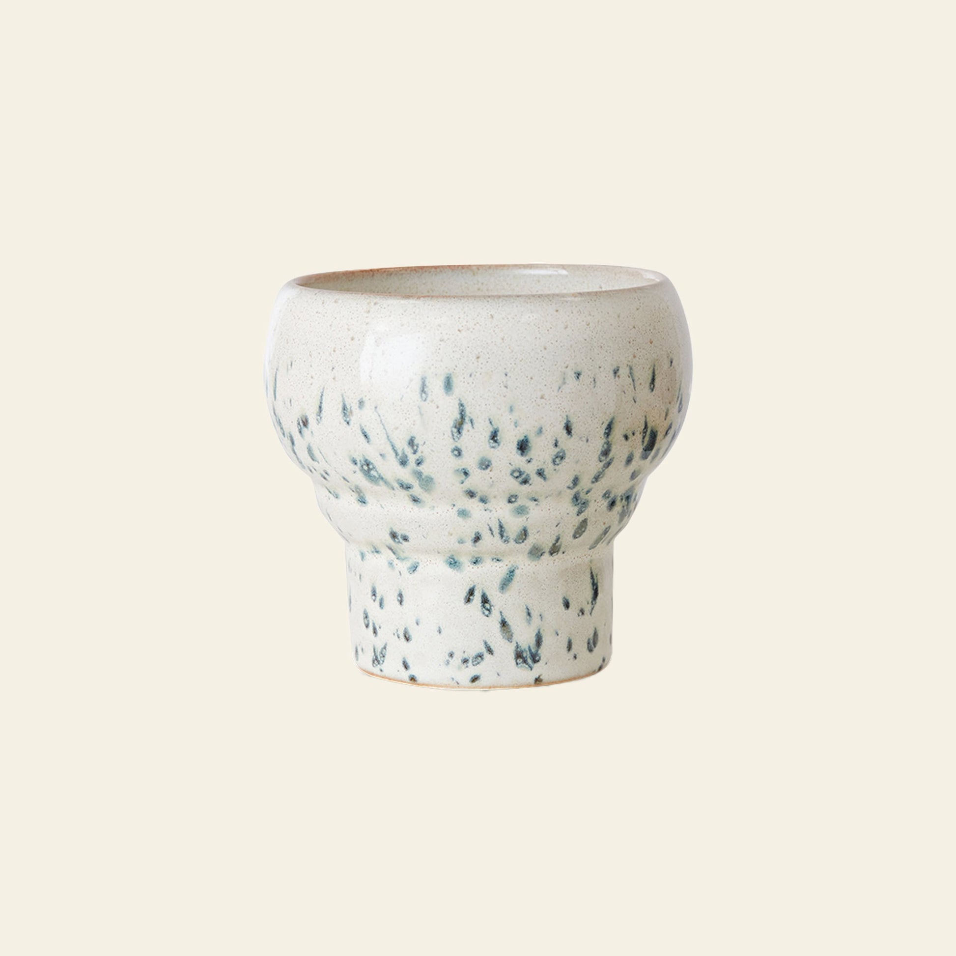 The HKLIVING 70s Ceramics: Lungo Mugs, Set of 2, features handcrafted ceramic mugs with a rounded top, narrower base, and white glaze with green speckles, evoking vintage charm against a plain light background.