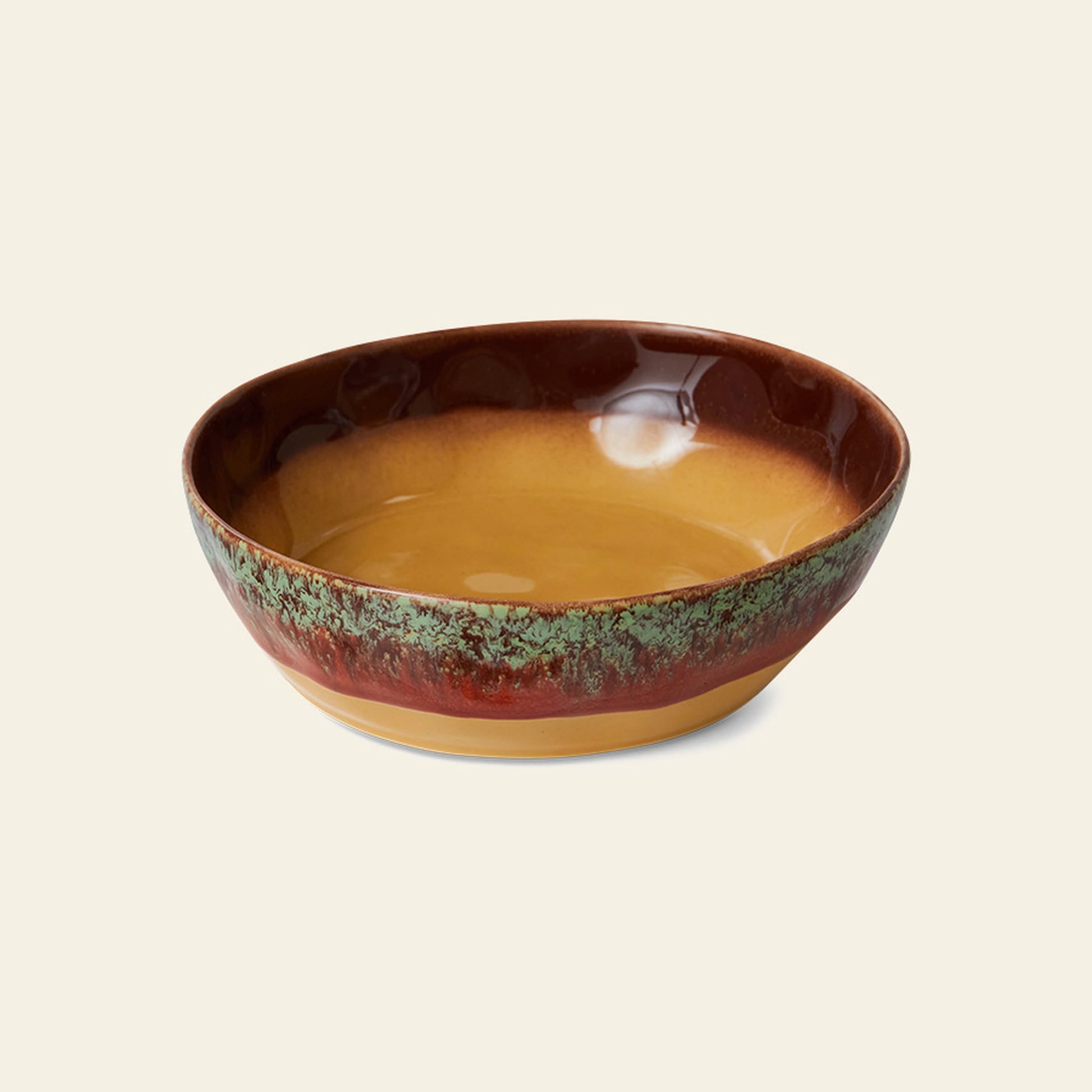 The HKliving 70s Ceramics Pasta Bowls, Set of 2, features shallow ceramic bowls with a glossy finish, golden brown interior, reddish-brown and green textured rim, and tan base, set against a plain light background.