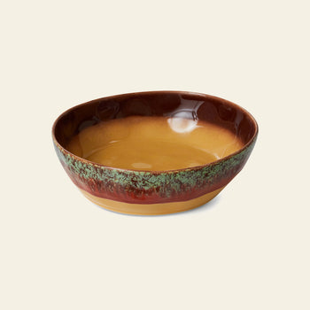 The HKliving 70s Ceramics Pasta Bowls, Set of 2, features shallow ceramic bowls with a glossy finish, golden brown interior, reddish-brown and green textured rim, and tan base, set against a plain light background.