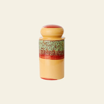 The HKLIVING 70s Ceramics: Storage Jar - Cove features yellow, red, and green speckled bands around its center and a rounded lid, reflecting the brand’s retro style against a plain beige background.