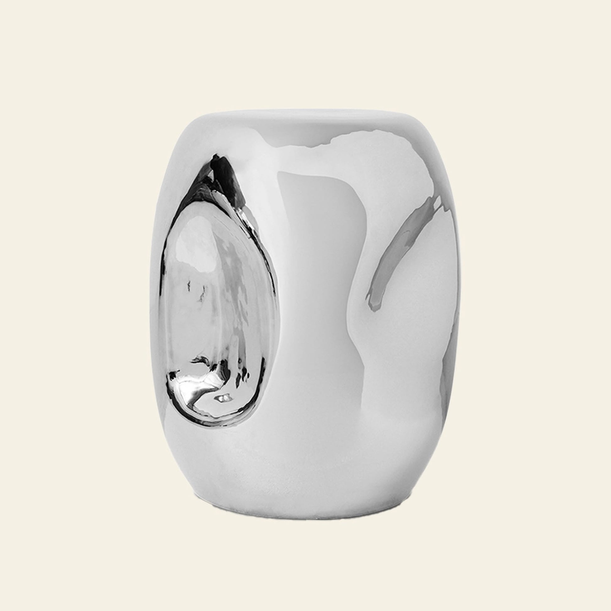 The HKLIVING Currents Chrome Side Table by HKLIVING is a reflective, silver, cylindrical piece with a polished chrome finish, smooth rounded surface, and an indented oval detail—ideal for contemporary interiors.
