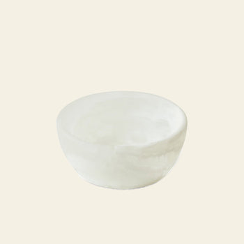 The HKLIVING Patio Bowl by HKLIVING is a small, round white ceramic bowl with smooth edges, displayed on a plain light beige background—ideal for outdoor entertaining.