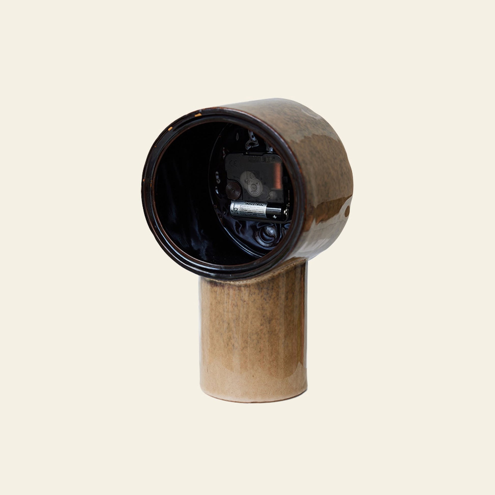 The HKLIVING Retro Ceramic Clock - Cream features a vintage-inspired ceramic design with a cylindrical base, rounded hollow top, and visible small mechanical component, all in cream tones by HKLIVING.