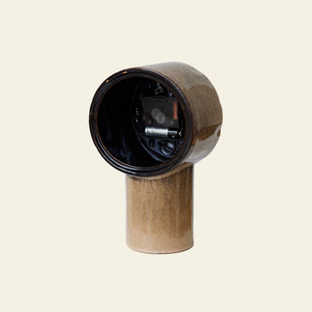 The HKLIVING Retro Ceramic Clock - Cream features a vintage-inspired ceramic design with a cylindrical base, rounded hollow top, and visible small mechanical component, all in cream tones by HKLIVING.