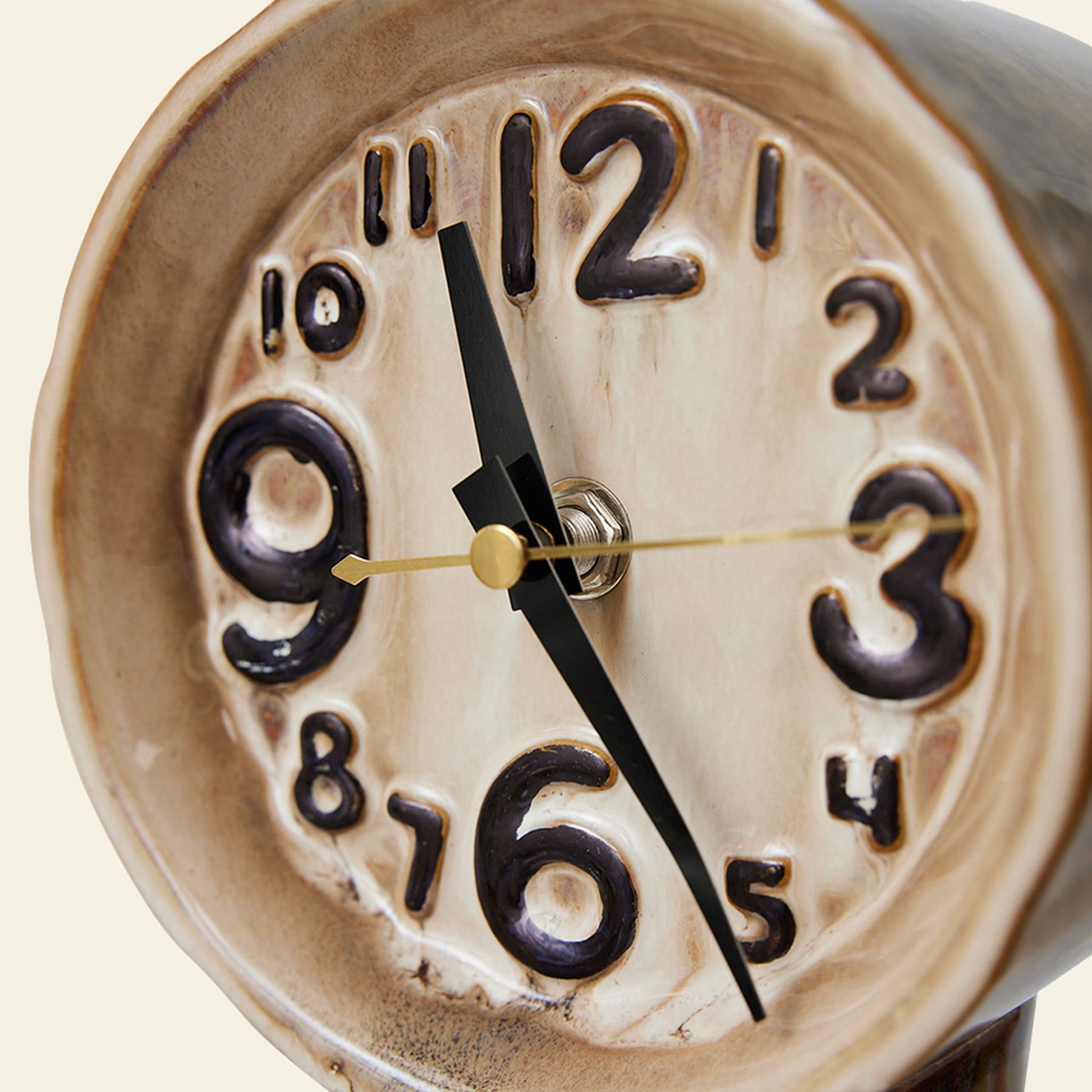 A close-up of the HKLIVING Retro Ceramic Clock - Cream shows raised, uneven black numbers and thick hands at 9:25, highlighting its handcrafted look and vintage-inspired design achieved with traditional firing techniques.