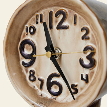 A close-up of the HKLIVING Retro Ceramic Clock - Cream shows raised, uneven black numbers and thick hands at 9:25, highlighting its handcrafted look and vintage-inspired design achieved with traditional firing techniques.
