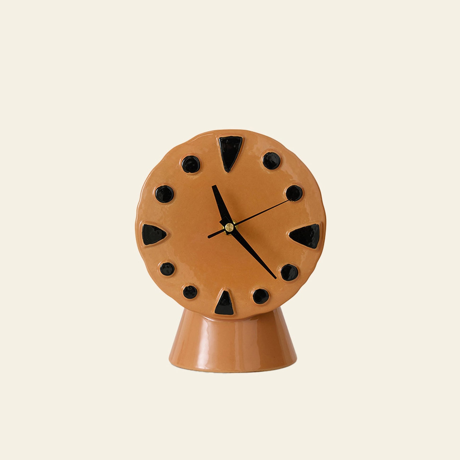 The HKLIVING Retro Ceramic Clock - Peach features black hour markers and hands on a matching base, its peach glaze highlighting traditional firing techniques, set against a plain light background.