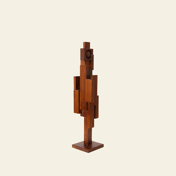 The HKLIVING Skyline Sculpture S - Espresso by HKLIVING features stacked rectangular and square teak wood blocks, resembling a stylized human figure and urban architecture, set against a light, plain background.