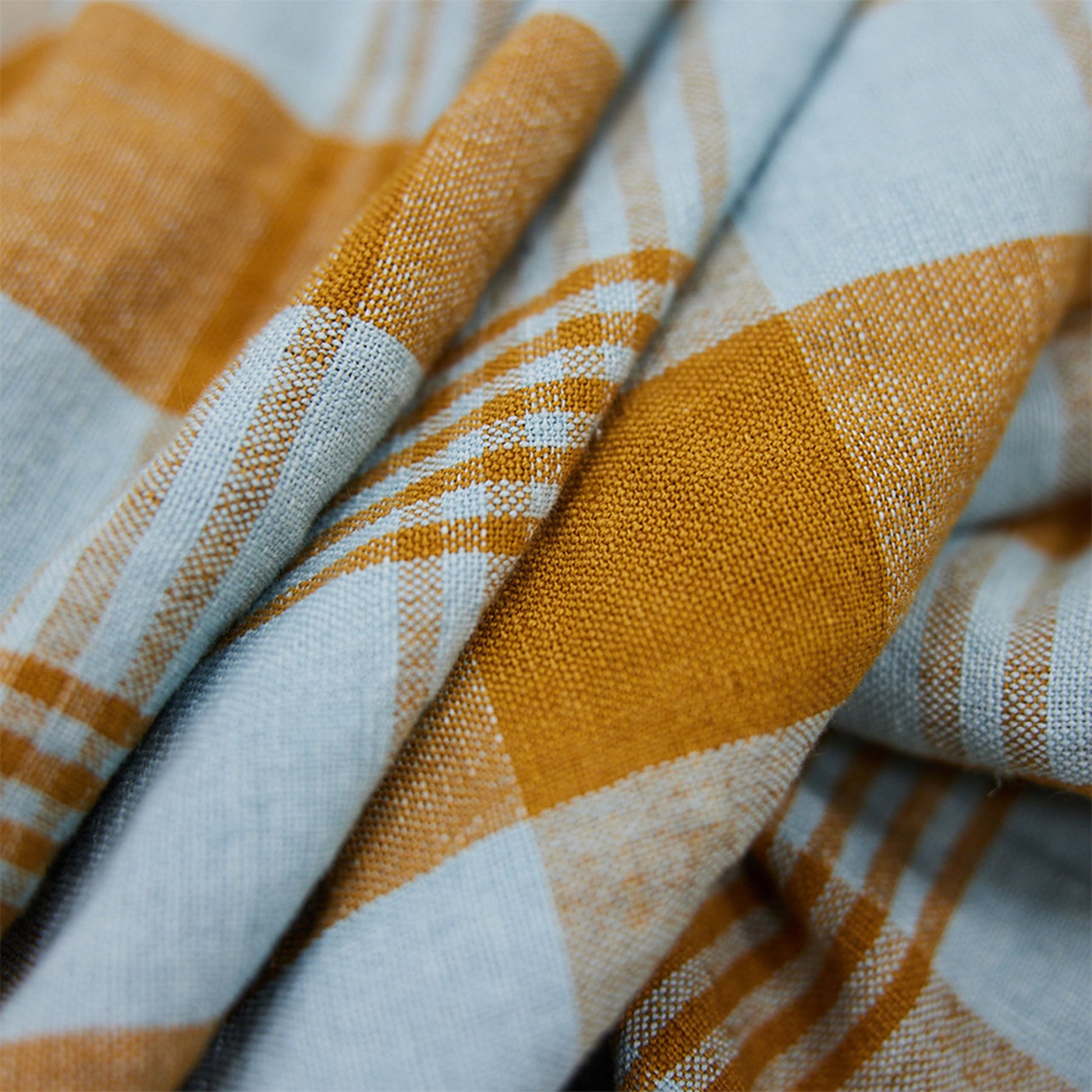 Close-up of the HKLIVING Vida Check Tea Towel in Amber/Blue, highlighting its detailed texture, gentle folds, and premium fabric—perfect for adding style to any kitchen.