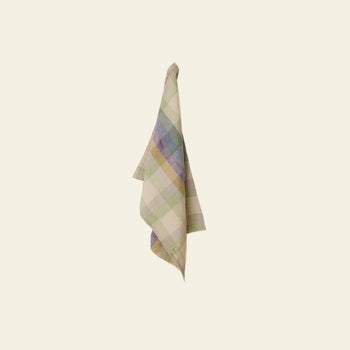 The HKLIVING Vida Check Tea Towel features a premium blend with pastel green, blue, and beige checks, and is shown hanging on a neutral light-colored wall.