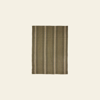 The HKLIVING Vida Striped Tea Towel in sand and cream features vertical black and beige stripes, echoing classic linen and cotton tea towel designs, shown against a plain light beige background.