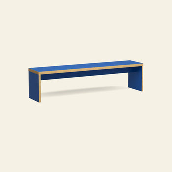 The HKLIVING Bench, 180cm by HKLIVING is a minimalist blue rectangular dining bench with natural wood edges, set against a plain off-white background—ideal as versatile seating for modern spaces.