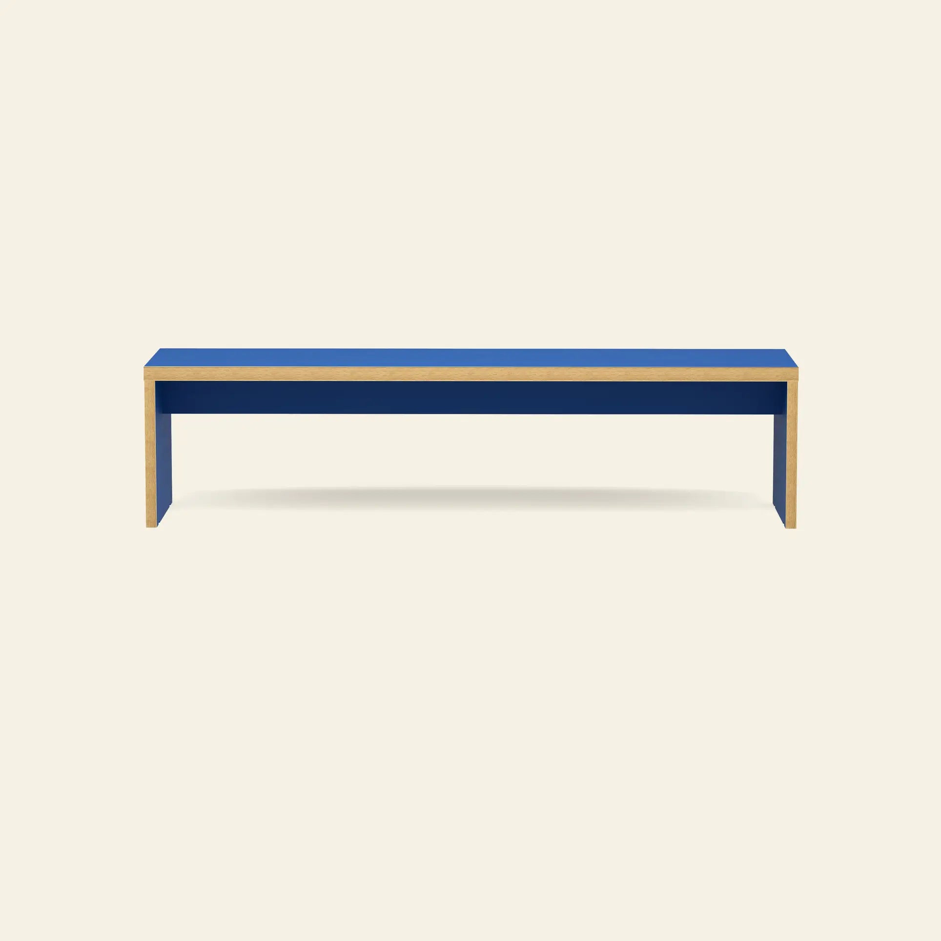 The HKLIVING Bench, 180cm by HKLIVING is a minimalist, space-saving seat with blue top and sides, natural wood edges—ideal for versatile seating in simple spaces.