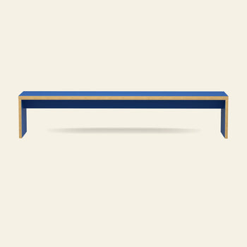 The HKLIVING Bench, 220cm, features a minimalist blue design with light wood edges and is showcased against a plain beige background.