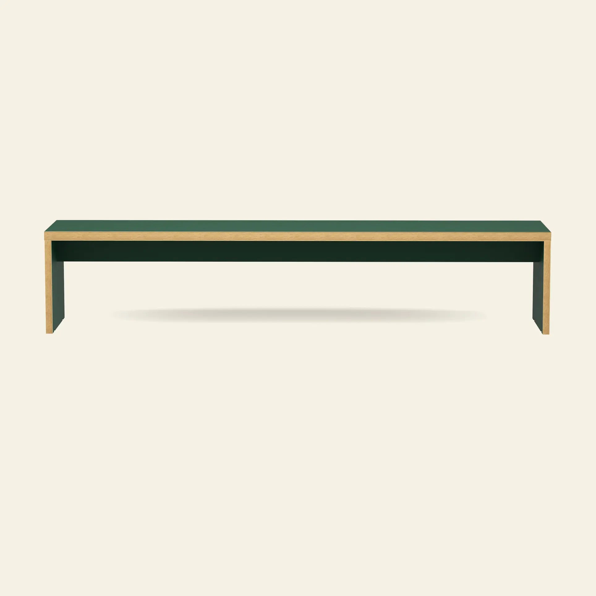 The HKLIVING Bench, 220cm, is a minimalist rectangular green dining bench with light wooden edges by HKLIVING, shown against an off-white background and casting a subtle shadow.