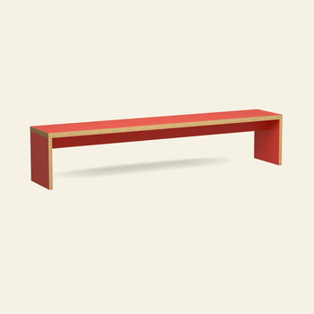 The HKLIVING Bench, 220cm, by HKLIVING features a minimalist rectangular design with wooden edges and no backrest, providing space-saving seating against a plain, light-colored background.