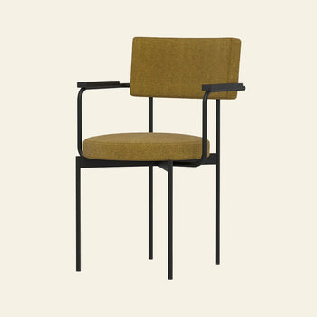 The HKLIVING Dining Armchair by HKLIVING features a modern design with a mustard yellow Main Line Flax upholstered seat and backrest, black metal frame, slim legs, and minimalist armrests against a plain light background.