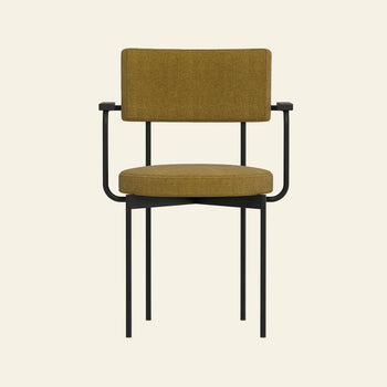 The HKLIVING Dining Armchair in Main Line Flax features a mustard yellow cushioned seat and backrest, black metal frame, and straight legs—modern Dutch design by HKLIVING, shown against a plain beige background.