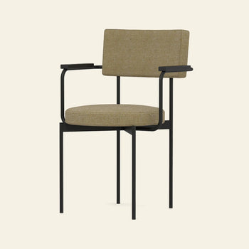 The HKLIVING Dining Armchair features a black metal frame with thin legs and armrests, plus cushioned seat and backrest upholstered in Main Line Flax fabric, shown against a plain beige background.