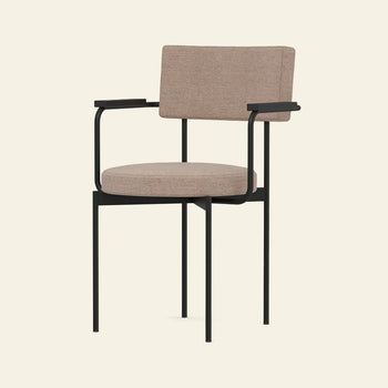 The HKLIVING Dining Armchair, Main Line Flax, Black by HKLIVING features a modern stackable design with a black metal frame, padded beige seat and backrest, and armrests with black accents—showcasing minimalist Dutch style.