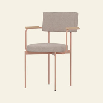 The HKLIVING Dining Armchair, Main Line Flax, Nude features a light beige upholstered seat and backrest, slim pink metal frame, and light wood armrests by HKLIVING, displayed against an off-white background.