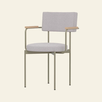 The HKLIVING Dining Armchair, Yoredale, Olive features a modern Dutch design with an olive cushioned seat and backrest, slim metal legs, and wooden armrests, shown against a plain off-white background.
