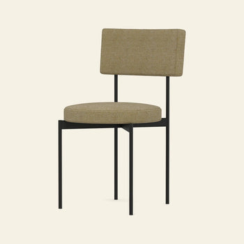 The HKLIVING Dining Chair, Main Line Flax, Black features a modern Dutch design with tan upholstery on the seat and backrest, supported by a minimalist black metal frame and slender legs, shown against a plain light background.