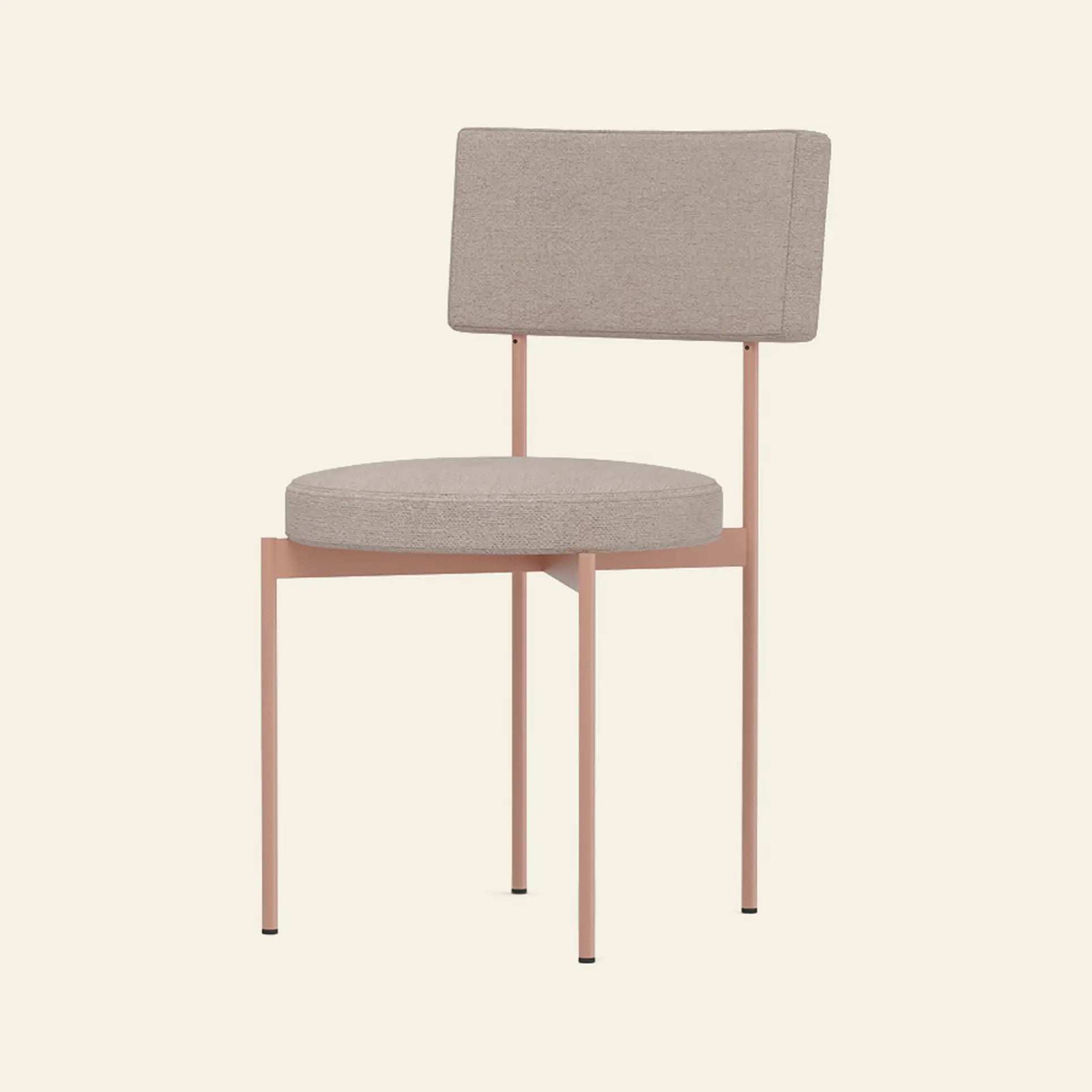 The HKLIVING Dining Chair, Main Line Flax, Nude by HKLIVING is a modern Dutch-designed chair with a round beige cushioned seat and matching rectangular backrest, supported by slim pink metal legs against a light background.