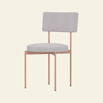 The HKLIVING Dining Chair, Yoredale, Nude features a Dutch design with a round gray cushion, rectangular backrest, and slim light pink metal legs by HKLIVING, set against a plain beige background.