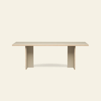 The HKLIVING Dining Table, Rectangular, 220cm, features a light wood top and two solid beige legs for a minimalist look. By HKLIVING, this elegant table offers ample space and fits beautifully in modern, understated dining rooms.