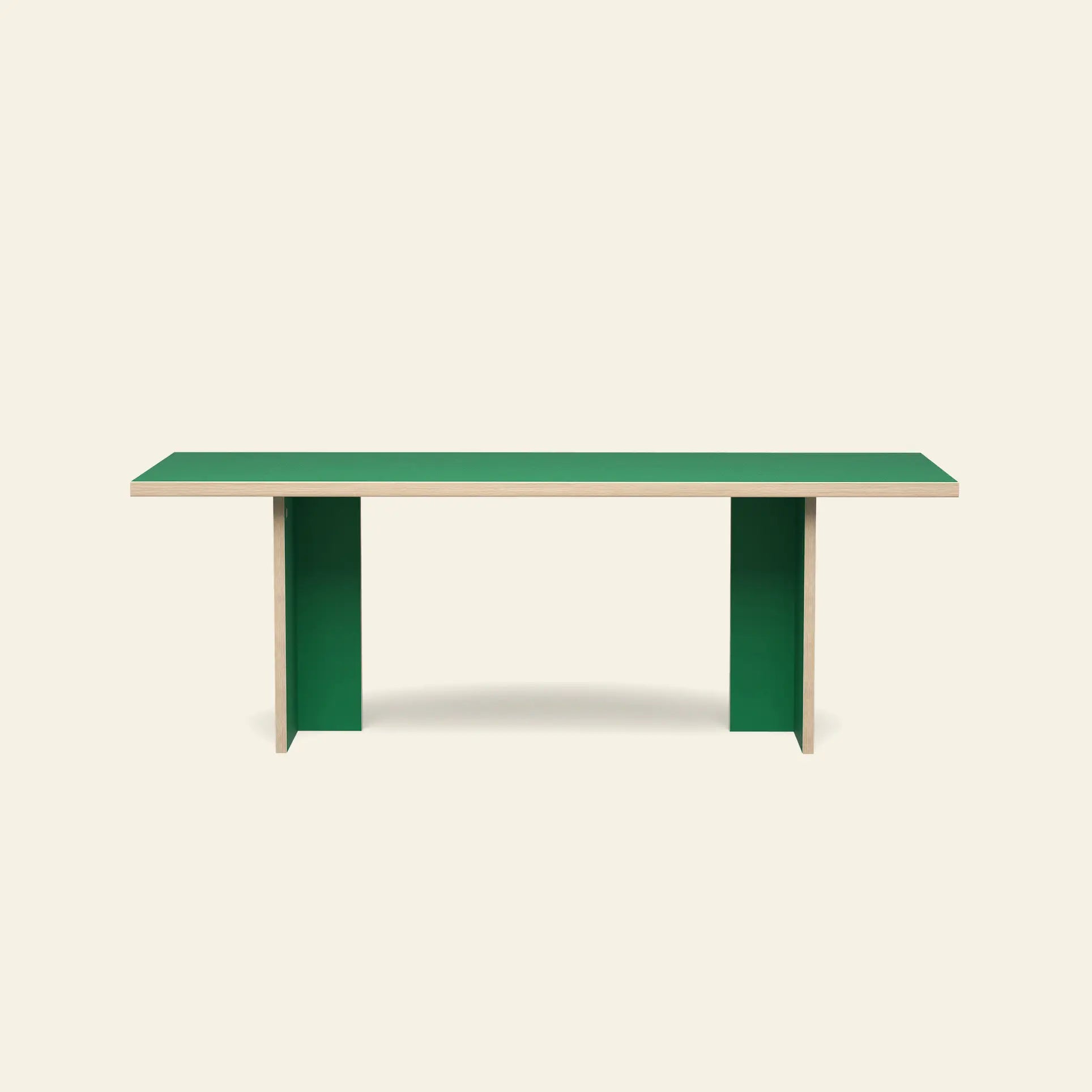 The HKLIVING Dining Table, Rectangular, 220cm, features a minimalist green top and vertical supports, blending clean lines with modern design against a plain beige background.