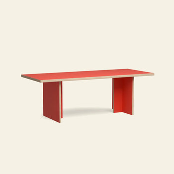 The HKLIVING Dining Table, Rectangular, 220cm by HKLIVING features a red top and red panel legs with clean, minimalist lines. Set against a plain light beige background, it offers a modern look for contemporary dining spaces.