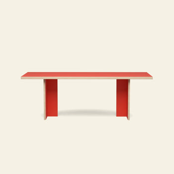 The HKLIVING Dining Table, Rectangular, 220cm by HKLIVING features a red top and two red vertical supports, offering a minimalist design with clean, modern lines against a plain off-white background.