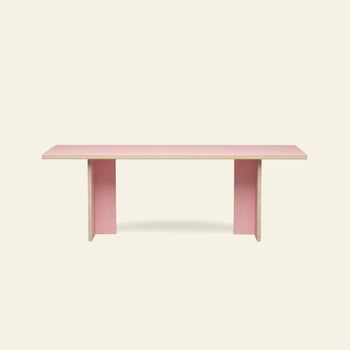 The HKLIVING Dining Table, Rectangular, 220cm, features a minimalist light pink top and legs with natural wood edges, set against a plain beige background.
