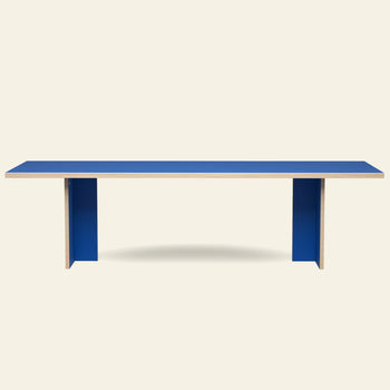 The HKLIVING Dining Table, Rectangular, 280cm features a modern blue top and panel legs in a minimalist design by HKLIVING, shown against an off-white background.
