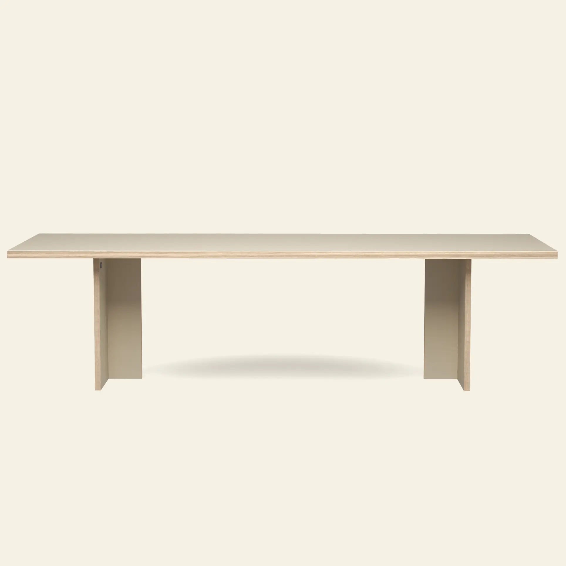 The HKLIVING Dining Table, Rectangular, 280cm by HKLIVING features a modern minimalist beige design with a flat rectangular top and wide end legs, shown against a plain light background.