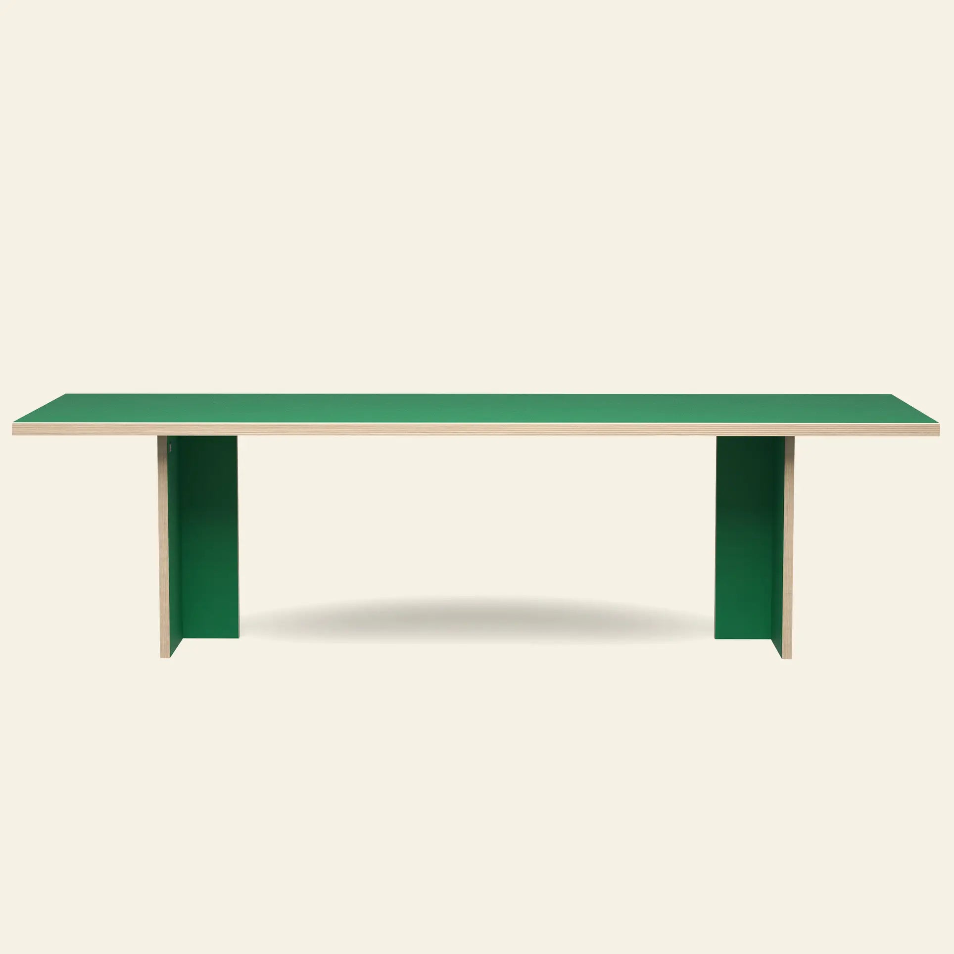 The HKLIVING Dining Table, Rectangular, 280cm features a minimalist green top and two wide green legs in a timeless design, set against an off-white background.
