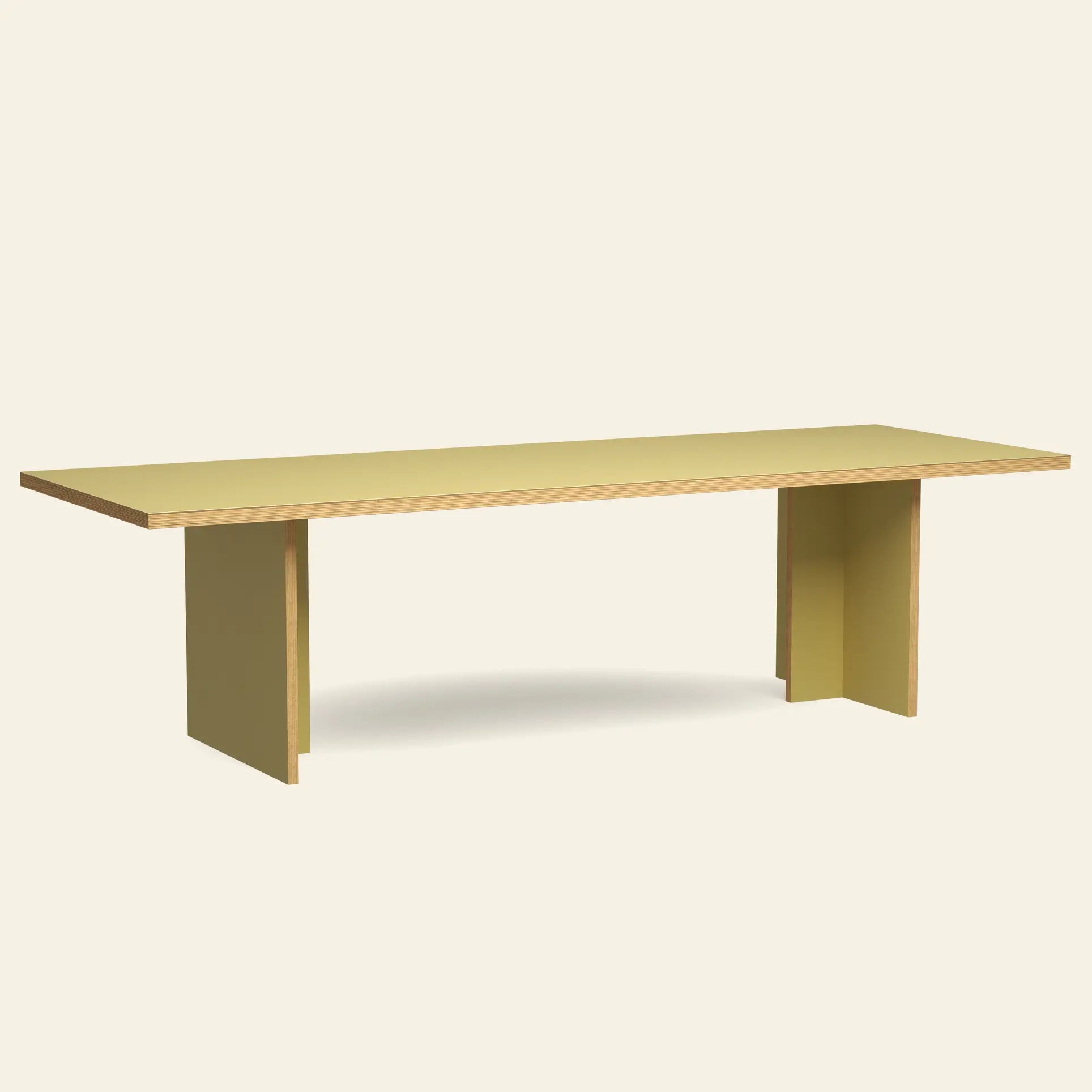 The HKLIVING Dining Table, Rectangular, 280cm combines minimalist style with a flat light yellow top and two thick perpendicular legs, highlighting timeless HKLIVING design against an off-white background.