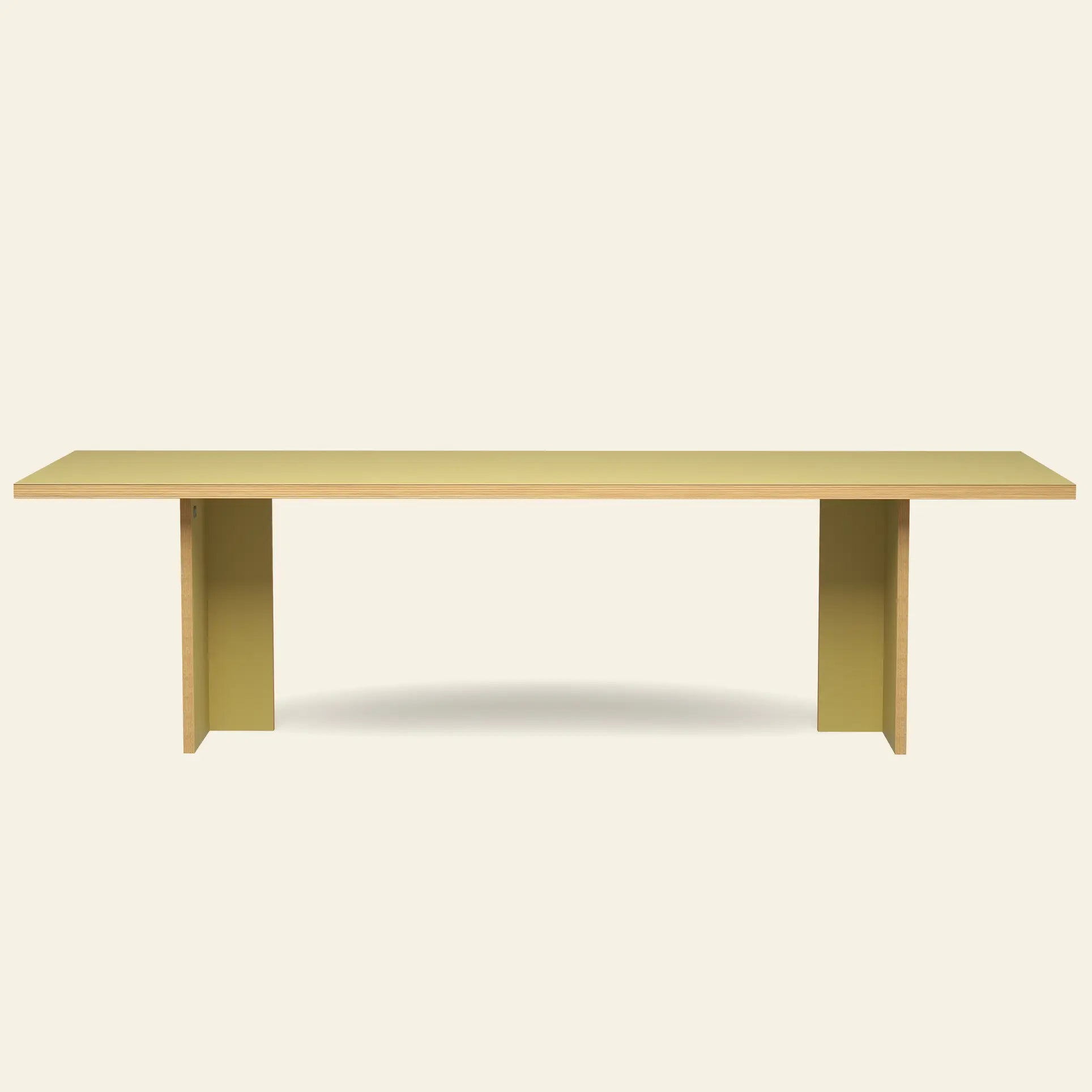 The HKLIVING Dining Table, Rectangular, 280cm by HKLIVING features a minimalist light yellow surface and two wide legs, reflecting timeless design against an off-white background.