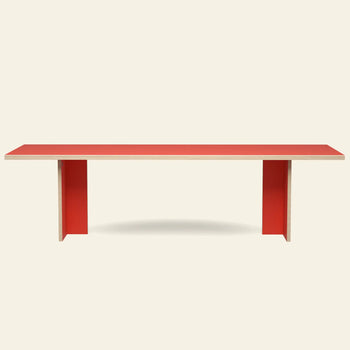 The HKLIVING Dining Table, Rectangular 280cm by HKLIVING features a minimalist red top and two wide red legs. Photographed against a plain light background, it reflects the brand’s timeless design aesthetic.