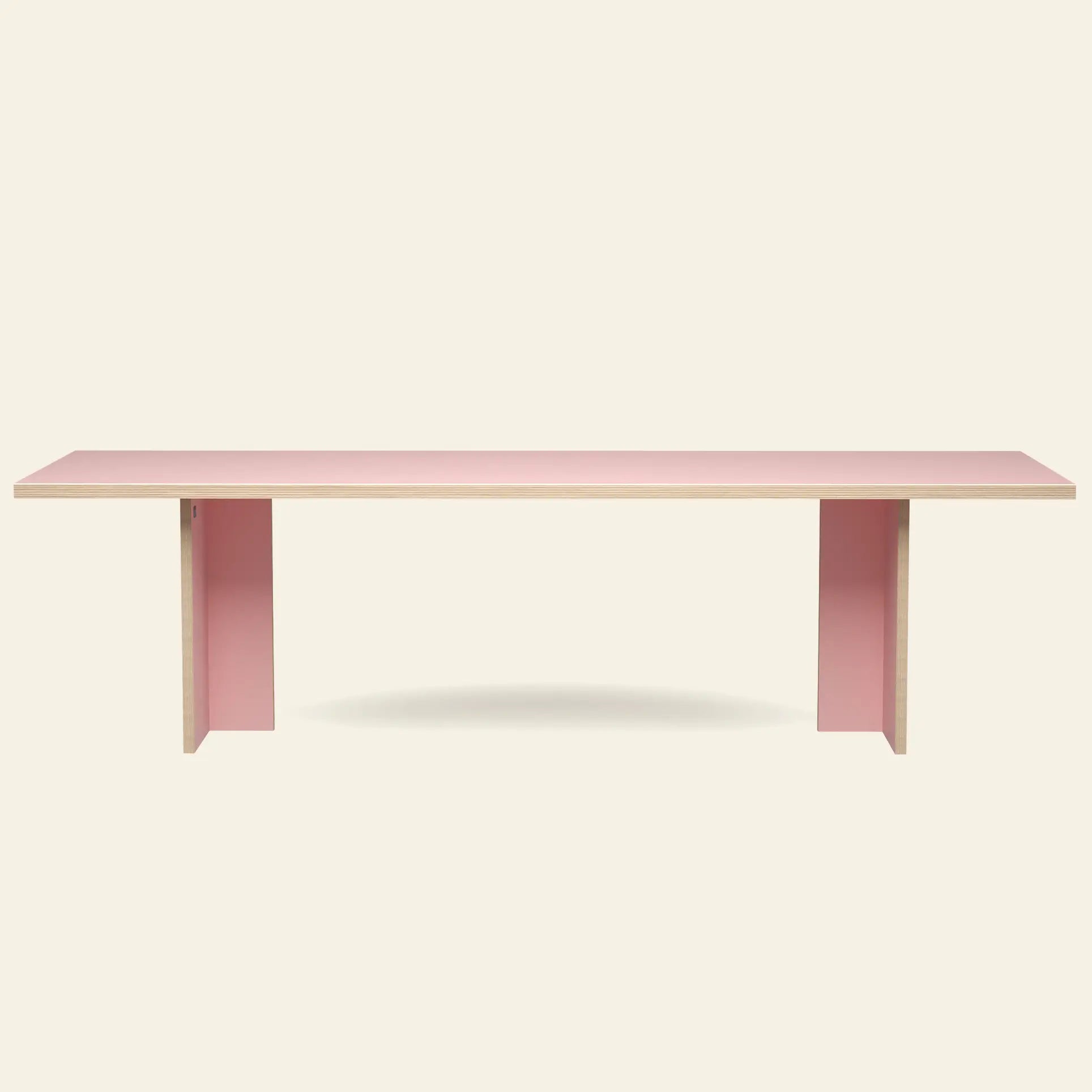 The HKLIVING Dining Table, Rectangular, 280cm features a minimalist light pink surface and matching panel legs—timeless HKLIVING design ideal for contemporary spaces, shown against a plain off-white background.